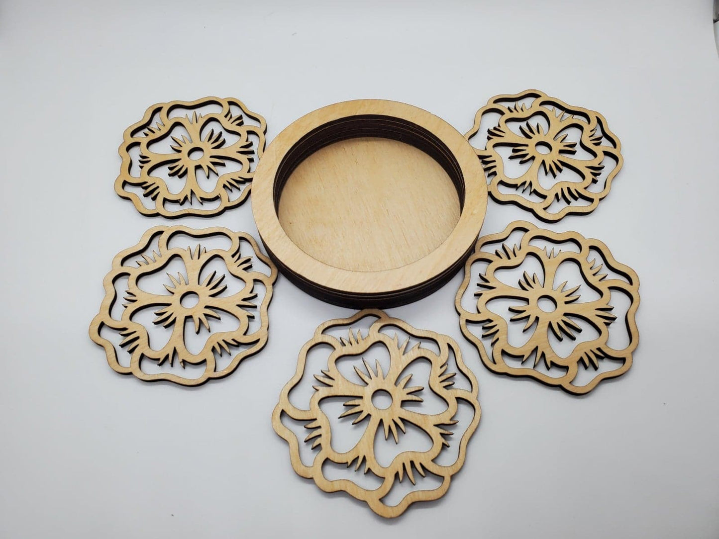 wooden coasters laser cut in floral design with holder in natural finish