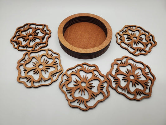 wooden coasters laser cut in floral design with holder stained in an oak finish